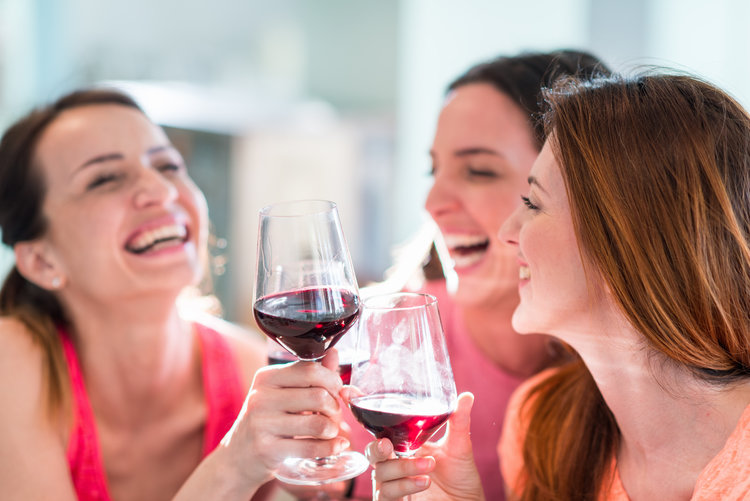 Friends Drinking Wine In Restaurant, Celebrating