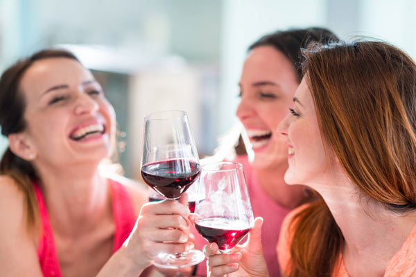 Friends Drinking Wine In Restaurant